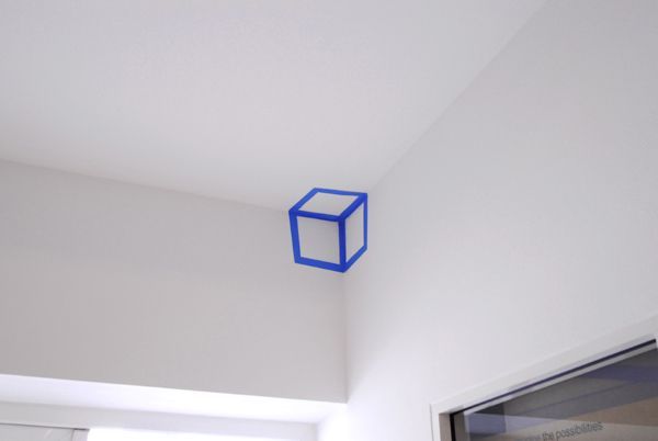 cool idea, paint or tape a line drawing cube into a three plane intersection of