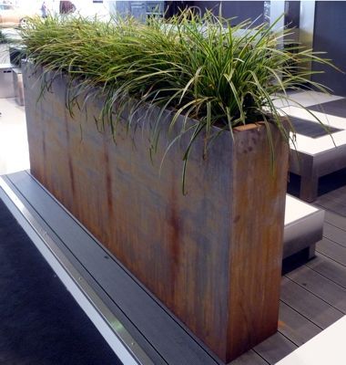 Corten steel planter provides privacy and art