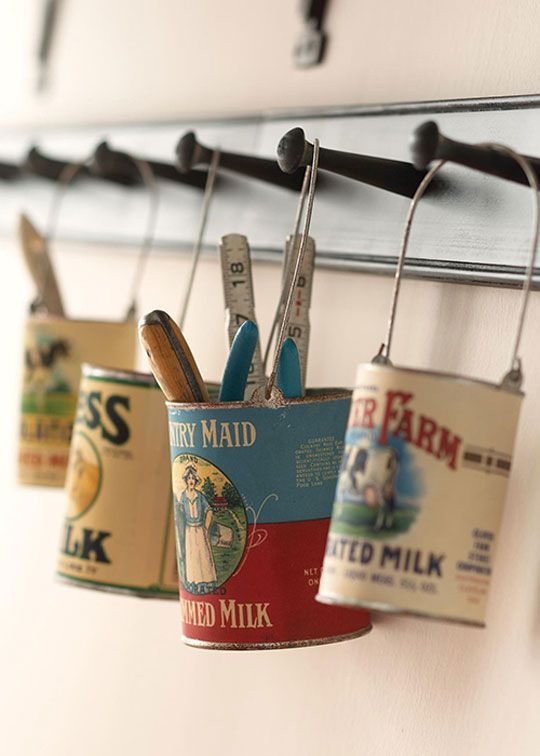 Hanging  cans with reproduction vintage labels corral tools, office supplies, or