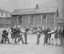 Hatfield children (left) and McCoy children (right)  playing Tug-of-War at the M