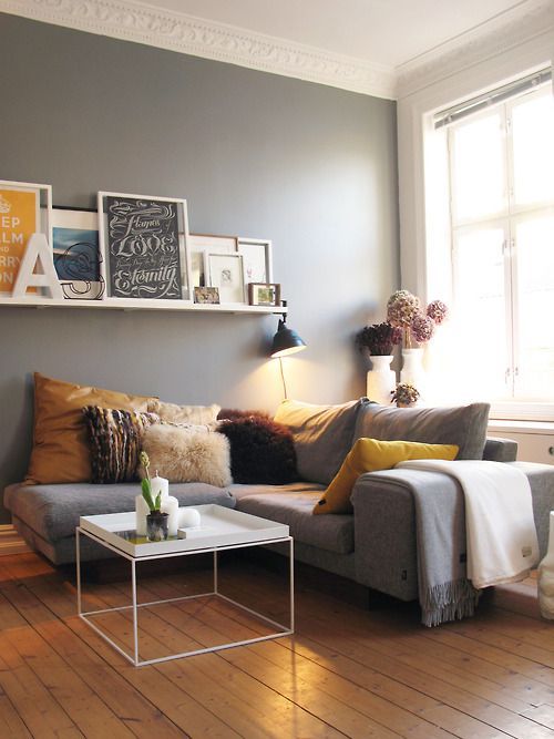 i never would have thought a grey wall with grey sofa would have worked but it d