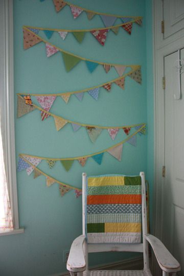 love the color of these walls and the bunting… perfect for the craft room:)