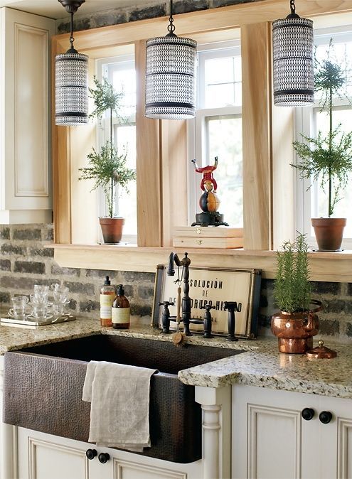 love the exposed brick backsplash and the farm house sink. I want exposed brick