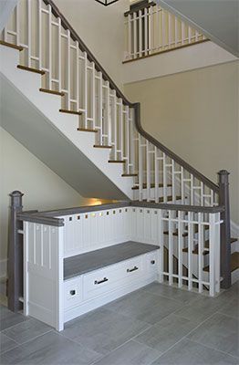 love this built in bench with storage in this open foyer