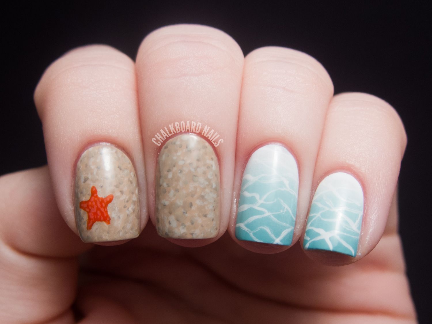 ocean and beach manicure with little orange starfish