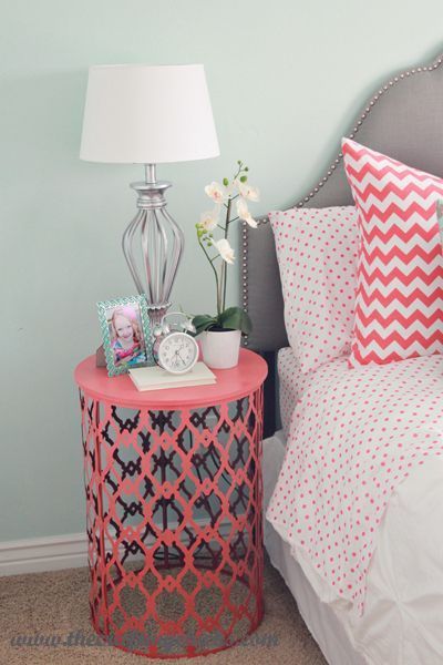 Painted trash can turned over as side table. Love this idea for a girls nursery.
