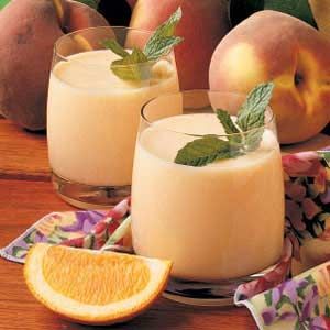 Peach Smoothies-2 cups milk  2 cups frozen unsweetened sliced peaches  1/4 cup o