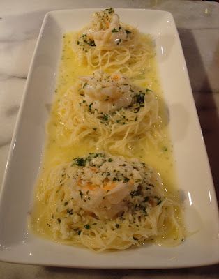 Shrimp with white wine sauce on pasta nests, just like they used to do at The Ol