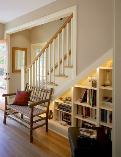 These bookshelves create a small library under the stairs..    via cg design-bui