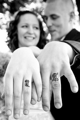 wedding ring tattoos. My husband and I have the eternity symbol on our fingers!