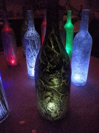 Wedding table centerpieces, table candles, wine bottle lanterns