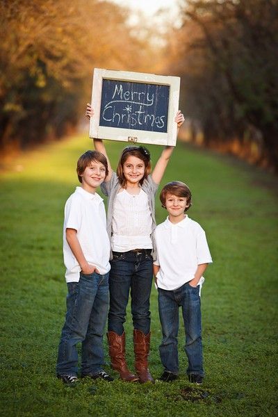 Christmas card photo ideas. I like how the kids are holding the chalk board but