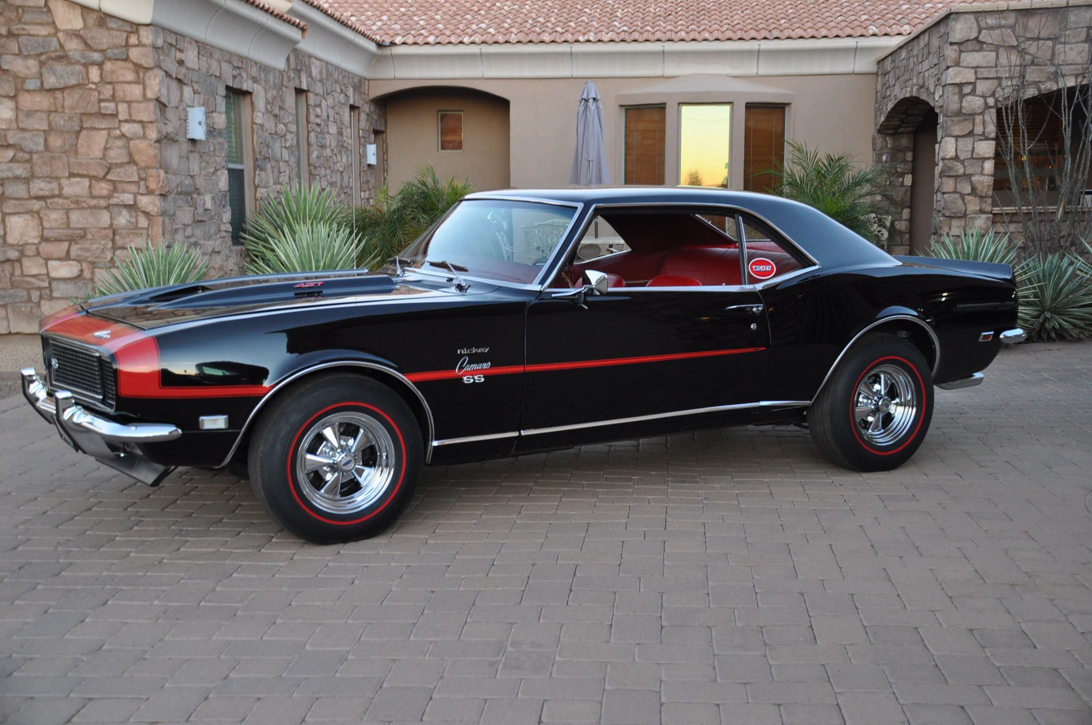 Classic Camaro SS looking sharp in red and black.