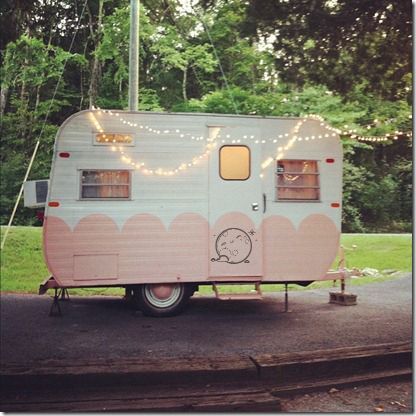 Cute vintage camper.  Love the paint job.