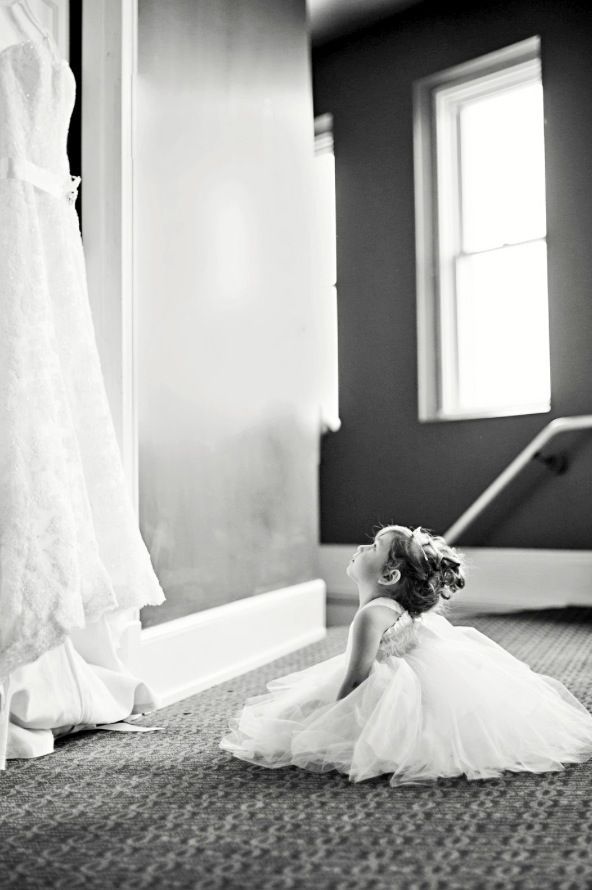 flower girl looking at the wedding dress… just love this