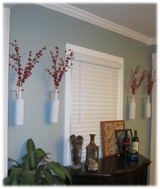 Hang wine bottles on the wall to use as vases! And where shall I get empty wine