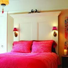 Like this idea…but not the bright pink.  LOVE the sconces on the sides.