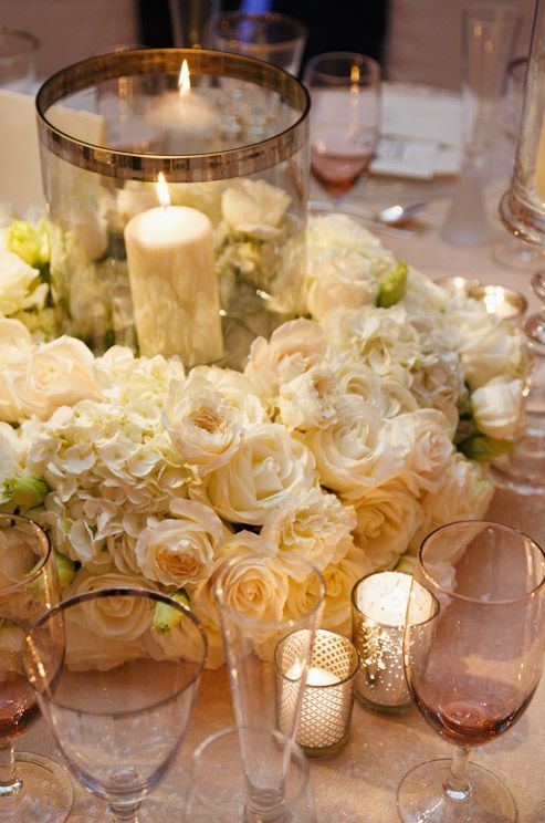 low centerpieces with candles, hurricanes and flower wreaths