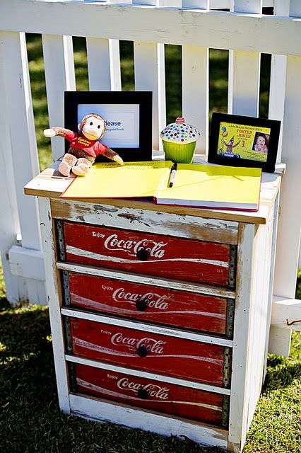 Old dresser with drawers replaced with the coke crates.  Use old pallet wood and