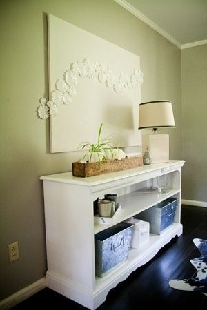 Upcycled dresser = tv stand Like how the doilys run off the framed canvas.