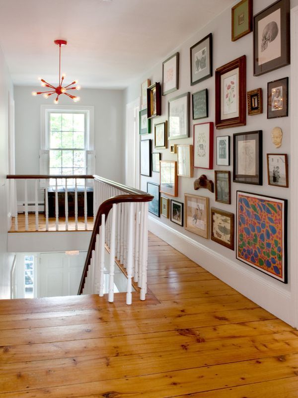 Use an eclectic mix when filling a hallway wall. This collection is easier to “s