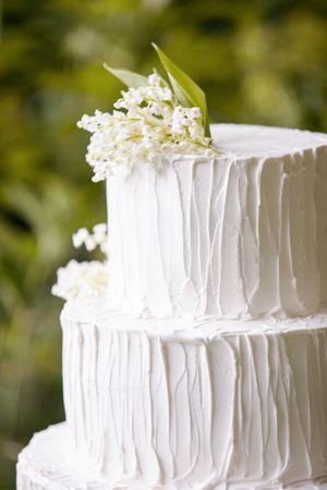 Wedding cake with lilies of the valley via Once Wed. Cake by Christine Dahl. Pho