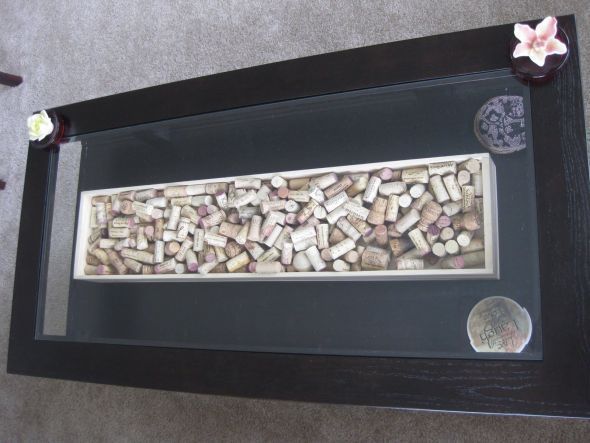 Wine theme wedding guest book. Have your guests sign wine corks and then put the