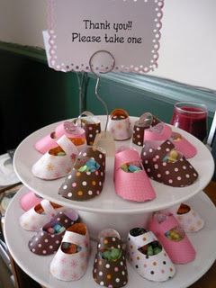 Baby shower ideas… baby shoes filled with treats for guest favors.