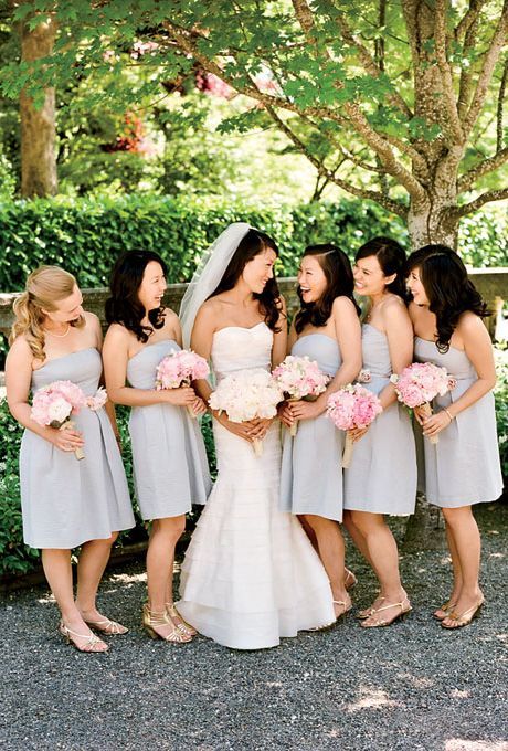 Bridesmaids in short, strapless, gray J.Crew bridesmaid dresses carried pink peo