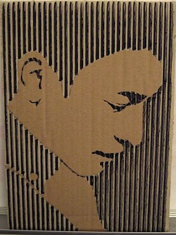 cardboard art made by cutting off the top layer of corrugated cardboard to revea