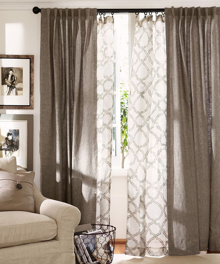 Give your windows depth! Layer curtains in the living room.