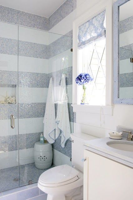 And more awesome stripes using mosaic tile in a bath. Love that they did all the