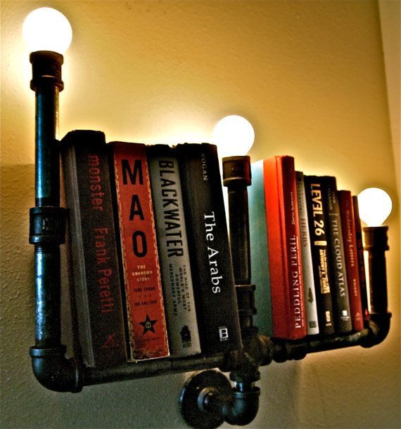 Industrial Pipe Bookshelf-  I could see this in a garage for all of Kyle’s car/t
