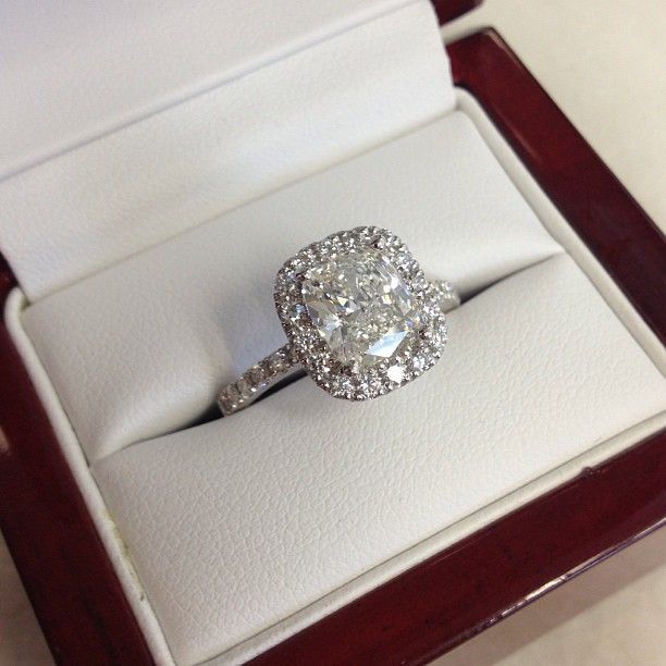 One of our most popular engagement rings! We love this cushion cut diamond halo