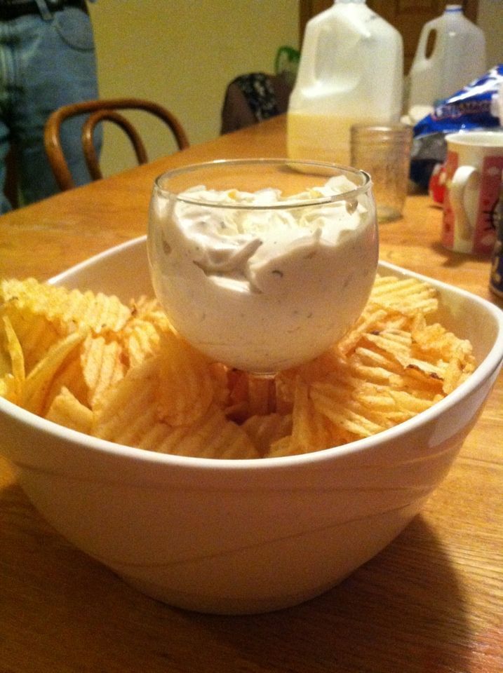 Put a wine or margarita glass in the middle of a large bowl for instant chip and