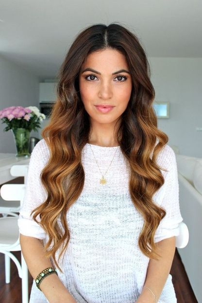 This middle part with loose wand curls is a trend that we are loving!