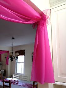 Use $1 plastic tablecloths to decorate doorways and windows for parties, etc.. W
