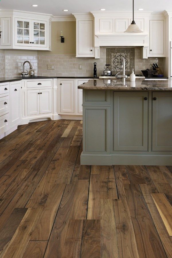What a BEAUTIFUL kitchen! Im in love with the rustic looking floors too!