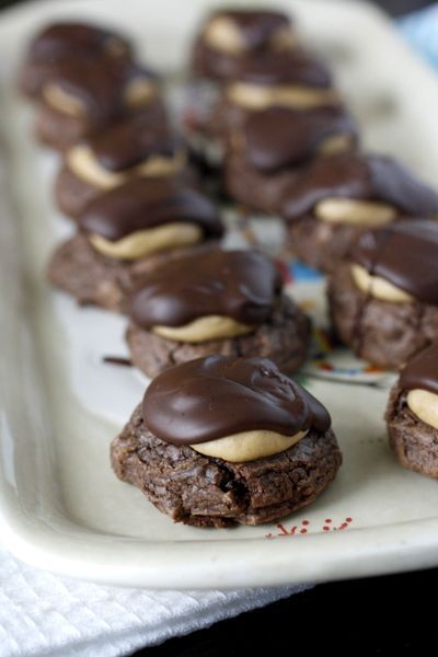 Buckeye Brownie Cookies – brownie cookie base with a peanut butter ball on top,