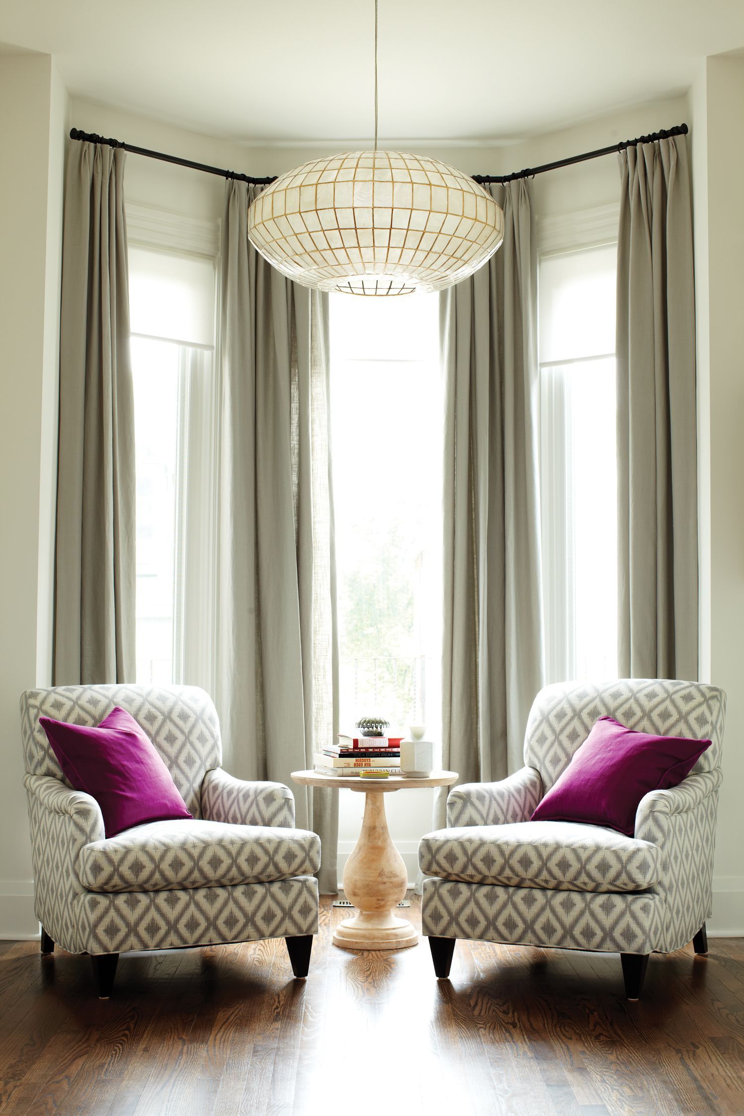 How to make the room look bigger: Living room, two armchairs, large chandelier,