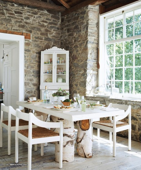 Room With A View – This rustic dining room has natural stone walls that were rev