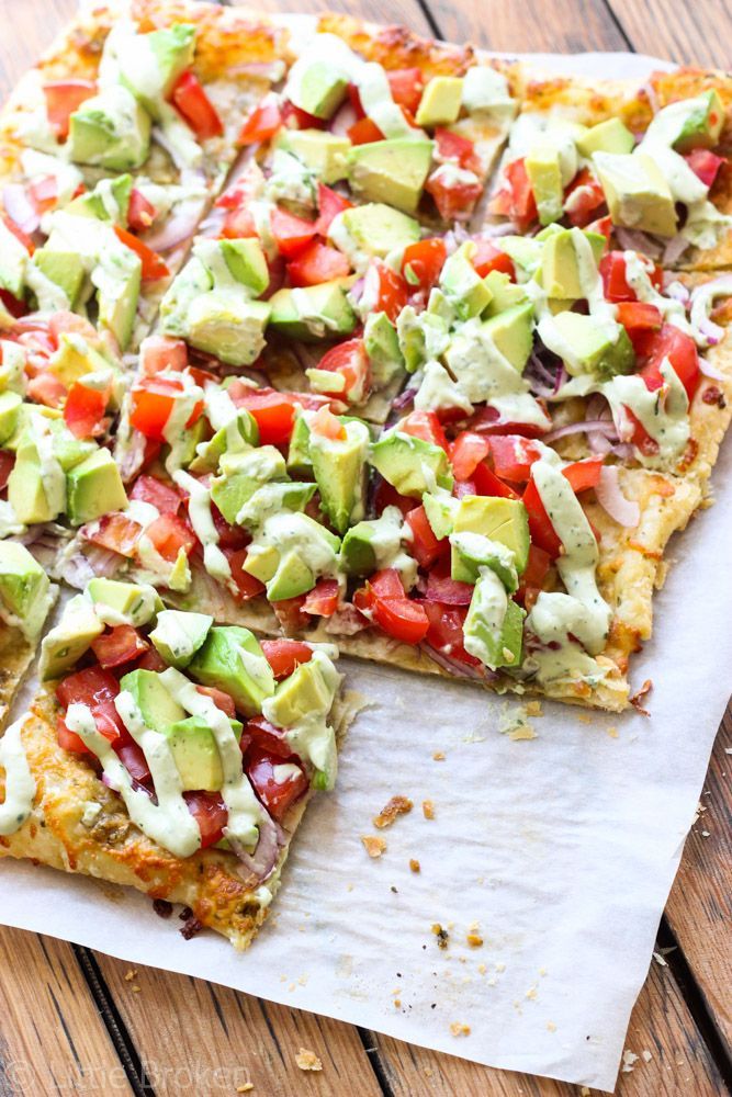 Skinny Avocado Pizza – Topped with avocados, tomatoes, red onion, cheeses, zesty