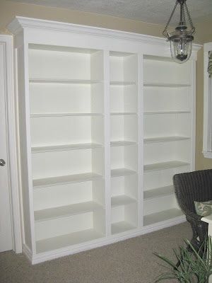 DIY built-in bookshelves – total project $250, basement hallway