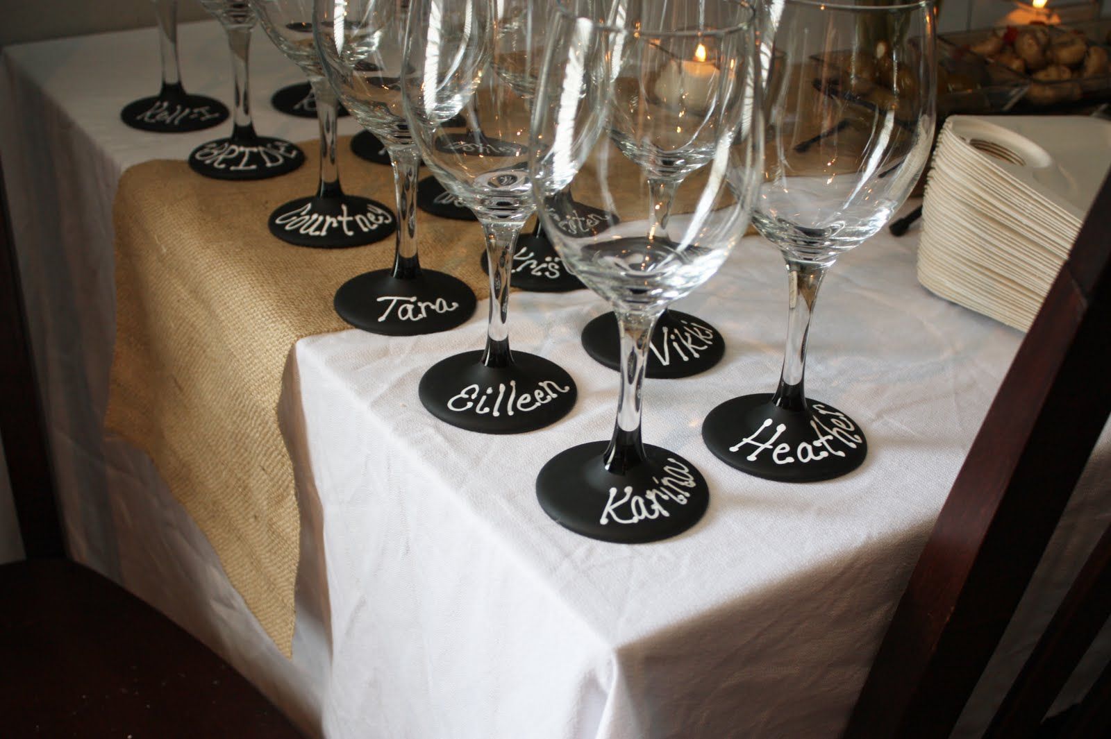 Dollar Tree $1 wine glasses painted with chalkboard paint. Perfect for this wine tasting bridal