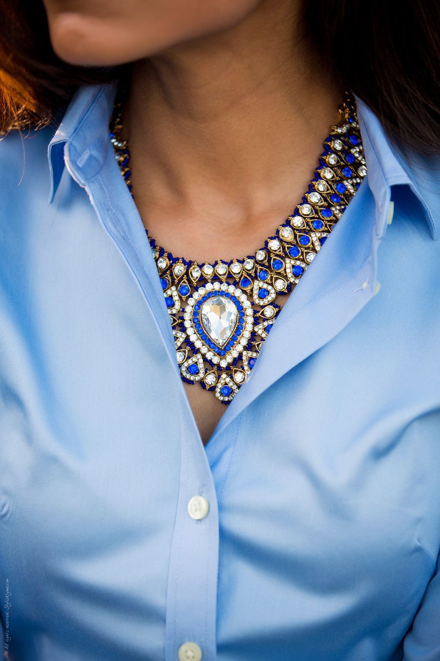 How to wear a statement necklace to the