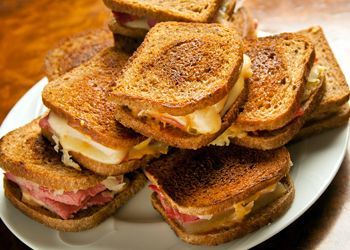 Mini Reubens! Who says these cant be served on Saint Patricks Day? The ultimate pub food- these delicious sandwiches are made with corned beef and sauerkraut