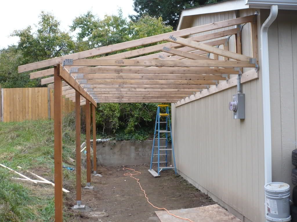 patio off of the garage pictures | TRUSSES FROM THE BACK – You can see the use of more ledger board