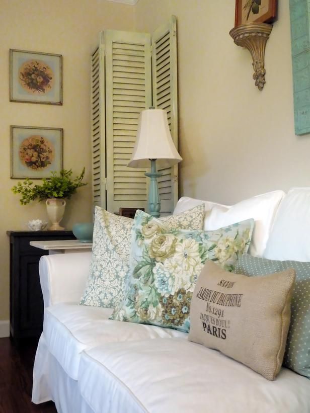 Shabby chic designs frequently include hints of European style. RMS user fleamarkettrixie brought a taste of Paris to her aqua-accented living room through this burlap throw pillow, as well as French