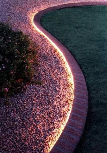 Solar rope lights in the garden. I LOVE this idea, it can be used in a number of of different uses in the yard, high lighting the path to the front and back doors. lighting up the gazebo (or any focus