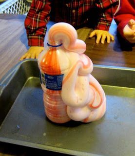 Elephant toothpaste: Set a soda pop bottle in the middle of a pan to catch the toothpaste.  Mix these in a separate container and swirl together for a minute. ** 2 tbsp warm water,  ** 1 tsp yeast.